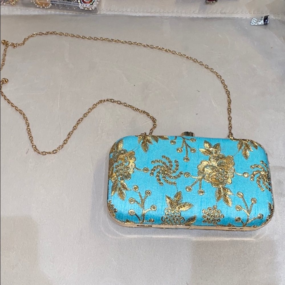 Teal and gold clutch